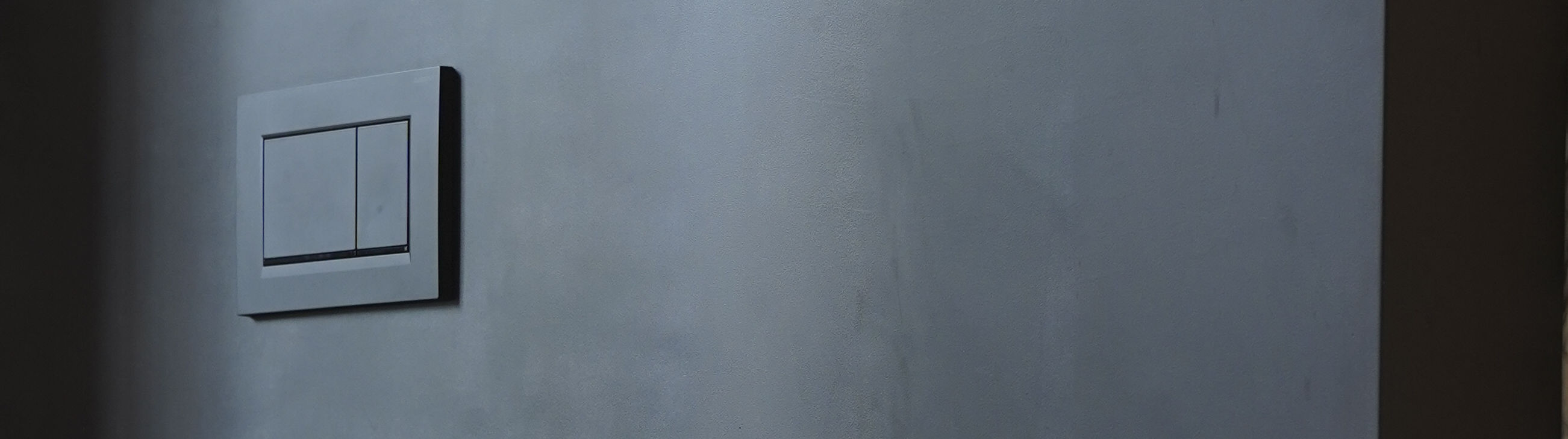 Wall with technical recessed luminaires in GFRC